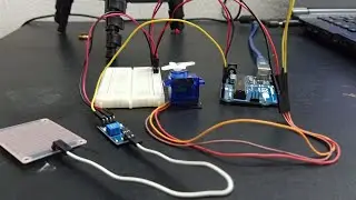 Rain drop sensor with servo motor