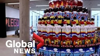 LEGO celebrates 90th birthday with 94,000-piece spinning cake