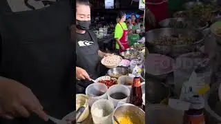 Full big plate! Lady chef making spicy Squid with instant noodle salad - thai street food