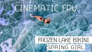 Cinematic FPV. Frozen lake bikini spring girl.