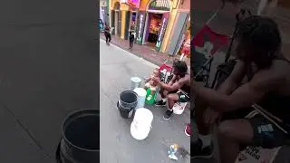 Bros hanging on a balcony in New Orleans