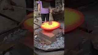 Forging Perfection: Red-Hot Steel Transformed from Cylinder to Flat Plate