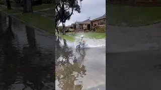 Puddle Play 💦 - When it rains, find the biggest puddle! #rainyday #childhoodmemories  #kidsonbikes