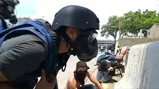 Venezuelan protesters continue fight on highway battleground