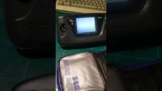 Sega game gear. playing sonic chaos. original screen.