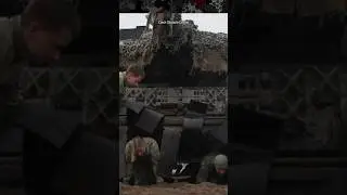 Soldiers Crawl Under a Leopard Tank