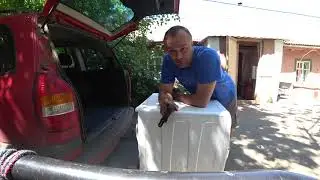 How to load a washing machine into the car without assistance?