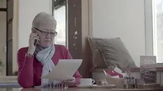 Active Pensioner with Short Hair Holding Important Documents (Stock Footage)