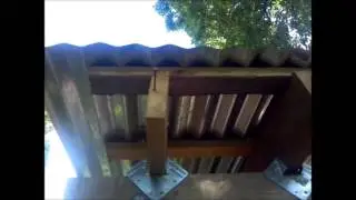Building Shed with Rough Cut Lumber - Putting on Tin Roof