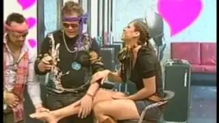 Woman has her boots and socks removed on TV