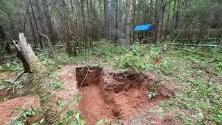 solo bushcraft. Start of underground shelter construction. Wild animals nearby