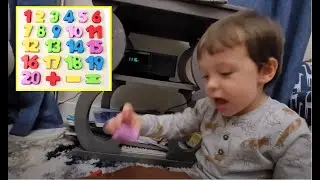Liam Completes His Wooden Numbers Puzzle