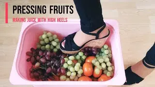 Pressing grapes and oranges with high heels to make healthy juice 