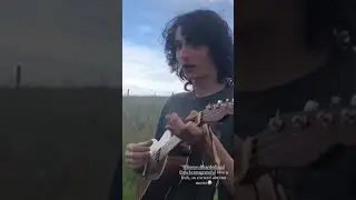 Finn Wolfhard playing the ukulele with McKenna Grace