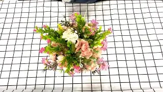 Artistic flower arrangement with roses as the main theme