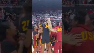 USC players celebrate on court after victory over Stanford