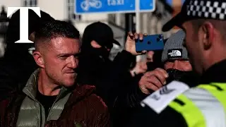 Far-right protester Tommy Robinson leads crowds through central London