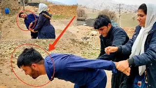 Rostam, a tough man: cementing the wall in rainy weather
