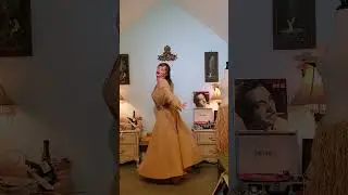 Dainty Rascal dancing in vintage cowgirl coat