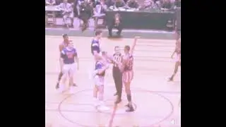 Wilt Chamberlain wins a jump ball over 2 men during his time with the Harlem Globetrotters (1958-59)