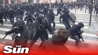 Riot police knock man unconscious during protest in Paris