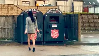 Crossdressing at the recycling centre wearing fishnet stockings and high heels.