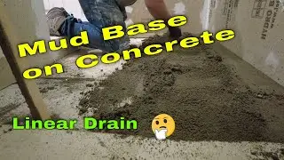 How to prep and install a mud base for a linear drain over an uneven concrete floor.