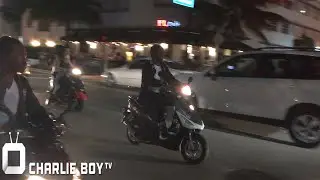 Future and Freeband Gang race around Miami Beach on scooters crashes one then returns it.