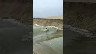 Surfer Gets Swept out to Sea by River Rapids 