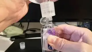 Refill small Purell hand sanitizer bottles without spilling or overflow from a large container