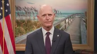 Senator Rick Scott congratulates Keiser University graduates