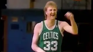 Larry Bird tries to miss a shot as part of a demonstration, but is unable to do so