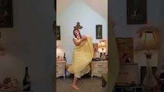 Dainty Rascal dancing in vintage yellow gown