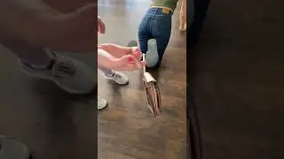 He shows the secret to the handcuff purse escape