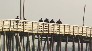 Car drives over edge of Virginia Beach fishing pier