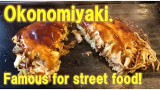 Making Okonomiyaki. Famous for street food and Traditional Osaka Food in Japan.