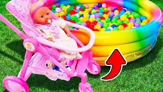 Feeding Baby Annabell doll in a toy feeding chair. A new stroller for the baby doll. Family videos.