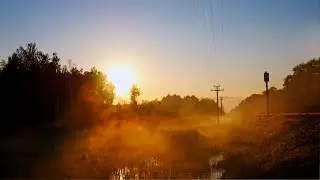 A beautiful sunrise at a distant railway station. Spring sounds of nature.