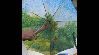 process of making an umbrella with a famous painting on it