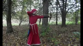 Лучница!    The girl shoots a long bow.