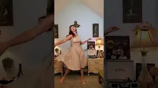 Dainty Rascal dancing in vintage glitter dress