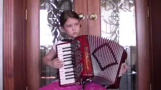 8-year-old girl playing accordion