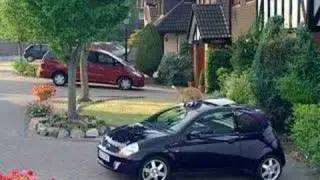 car commercial - sun roof feature, cat gets a suprise