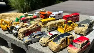 Find 20 types of Tomica in the mud and wash them!