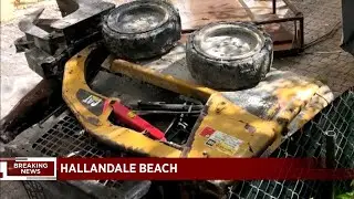 Worker inside front end loader falls from fourth floor of building