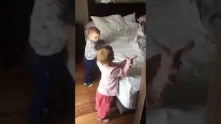 Toddlers Help Each Other Climb Bed While Crawling Up and Down Repeatedly - 1167787