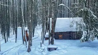 My log cabin in the snowy forest is off the grid. Bath arrangement inside. Relax in the snow.