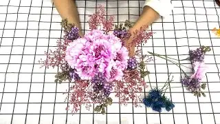 Share flower arrangements combining carnations, daisies and foam purple flowers