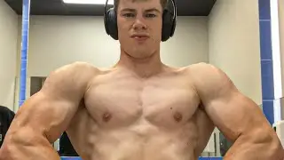 Teen boy flexing muscle