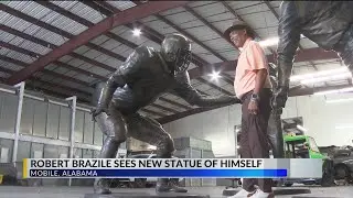 Robert Brazile reacts to seeing Mobile's Hall of Fame Walk statue for first time